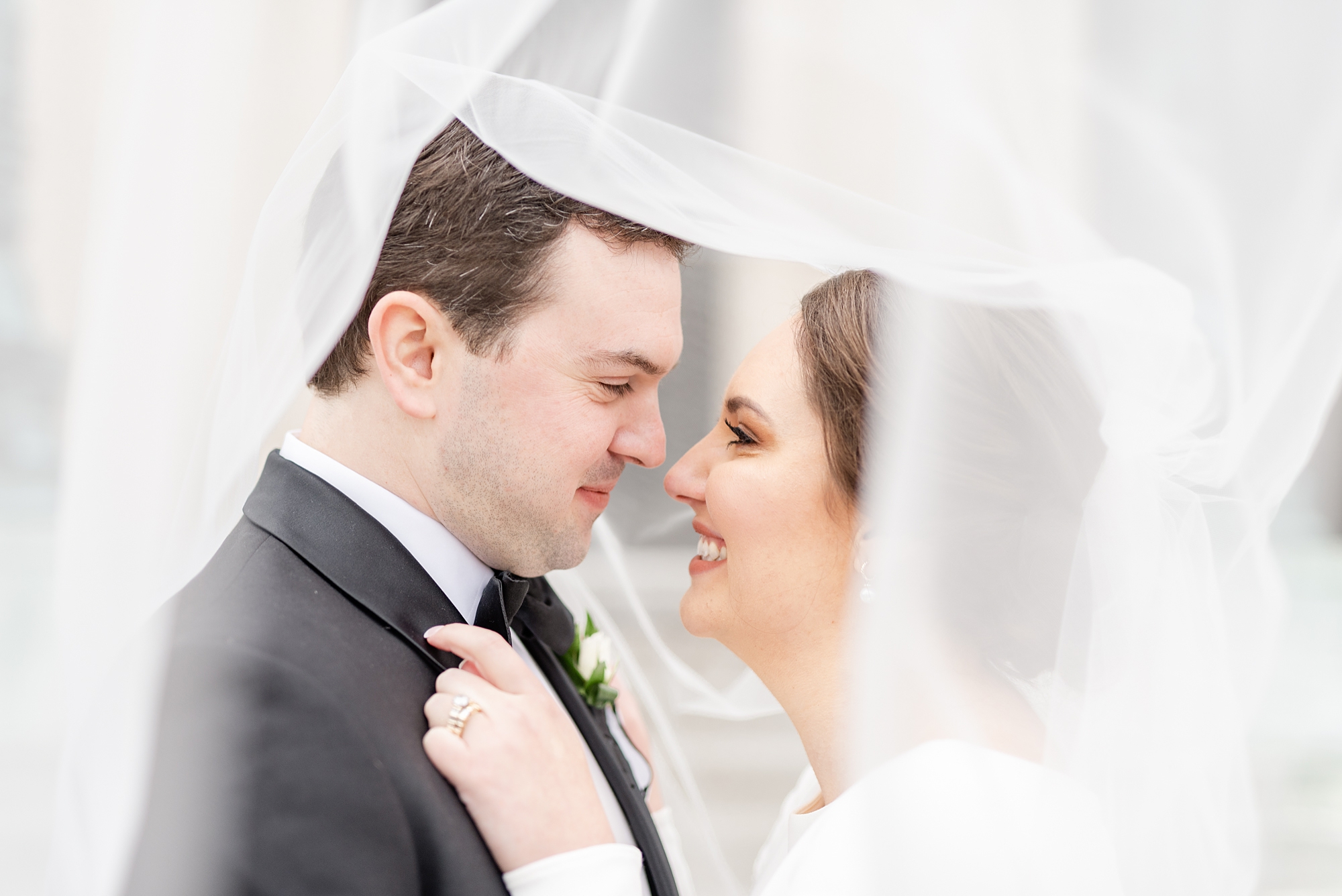 Dayton Masonic Center wedding portraits of newlyweds under veil