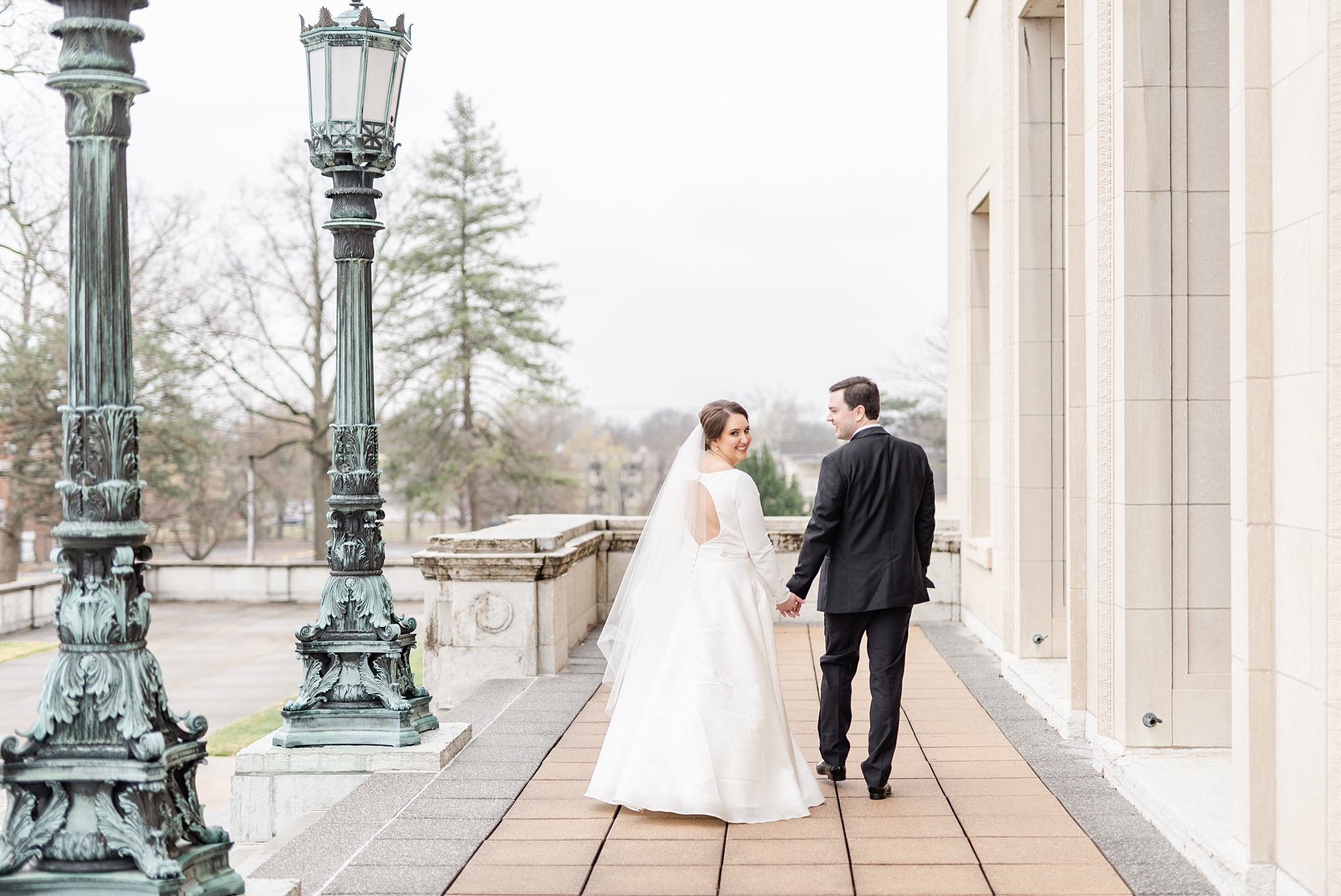 bride and groom walk along Dayton Masonic Center