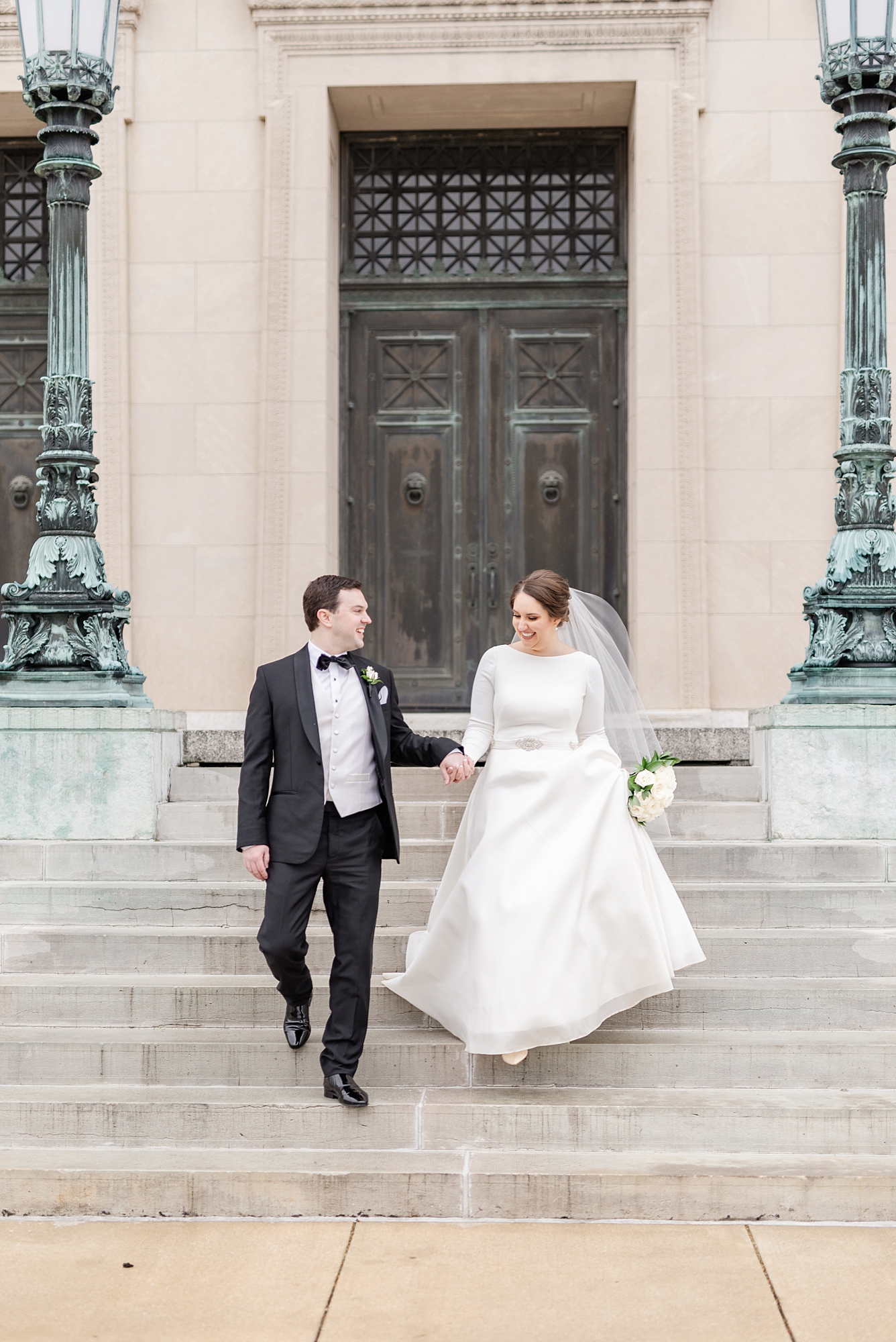 newlyweds walk down steps at Dayton Masonic Center