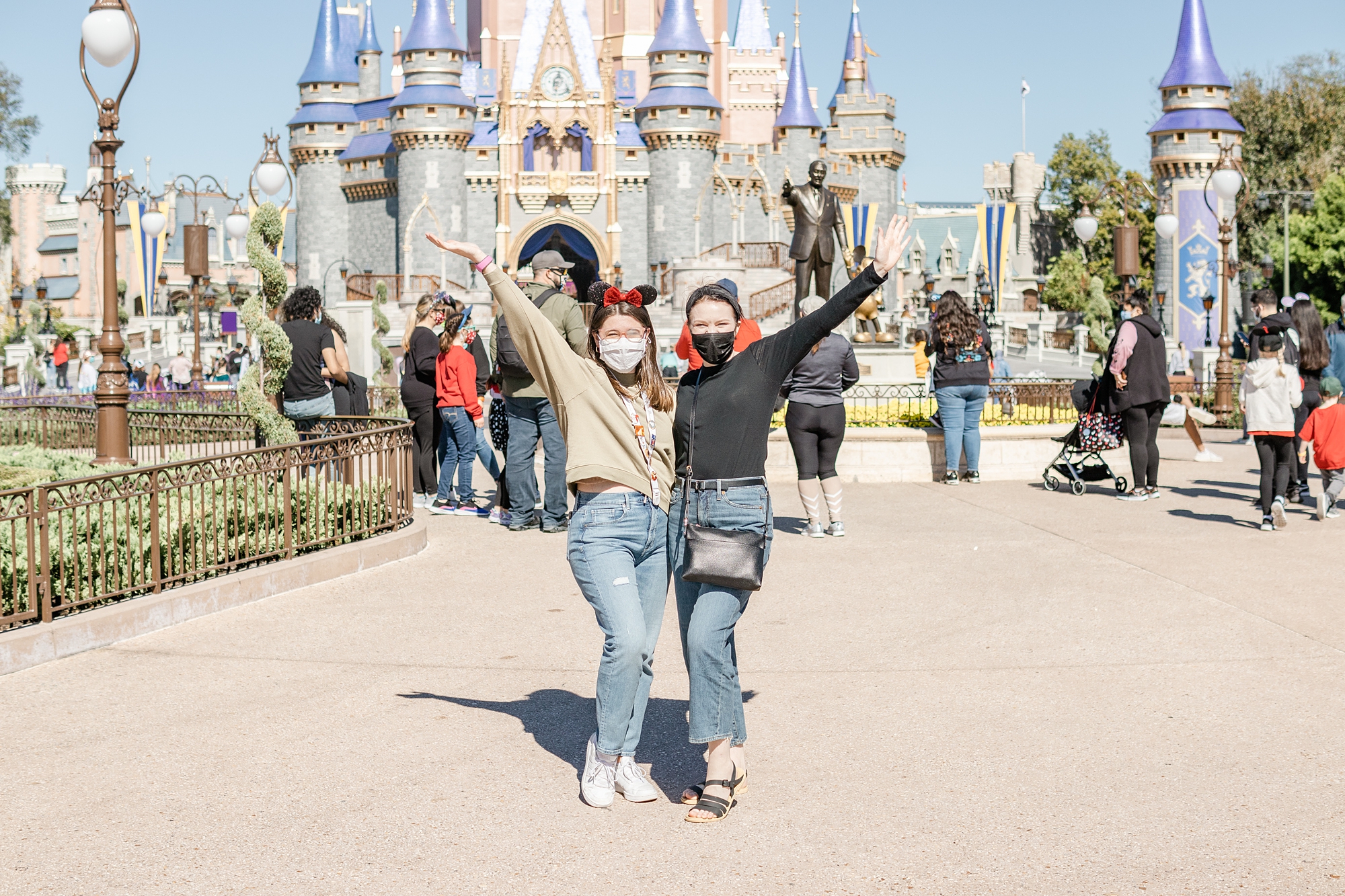 friends pose by castle in Magic Kingdom