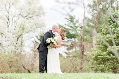 newlyweds kiss during first look at Estate at New Albany