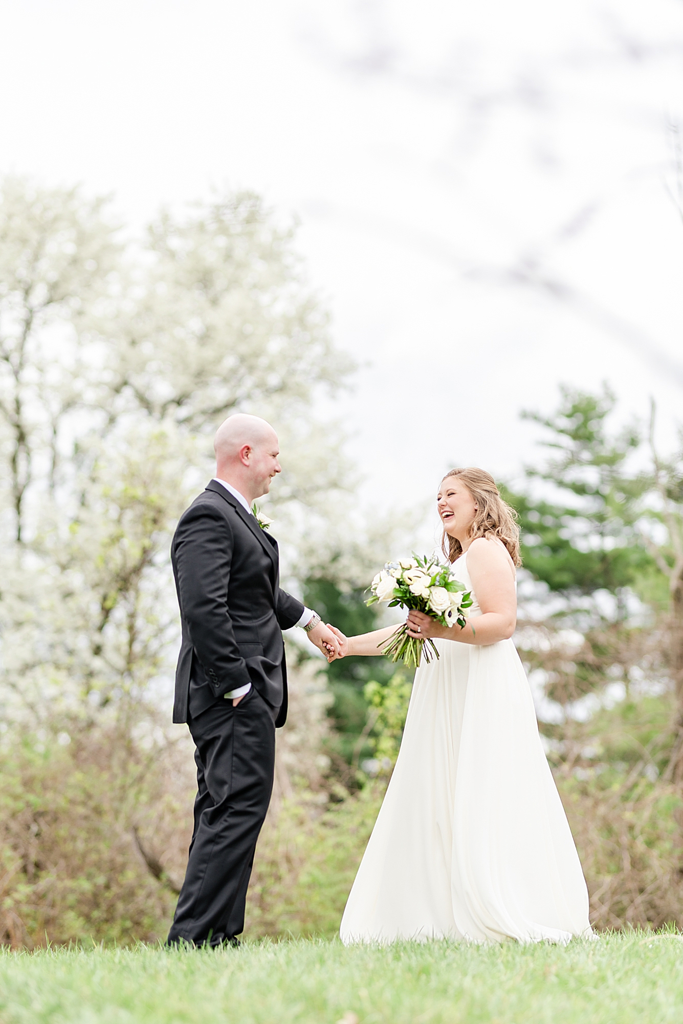 bride and groom talk during first look in Ohio