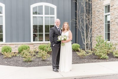 newlyweds pose outside The Estate at New Albany