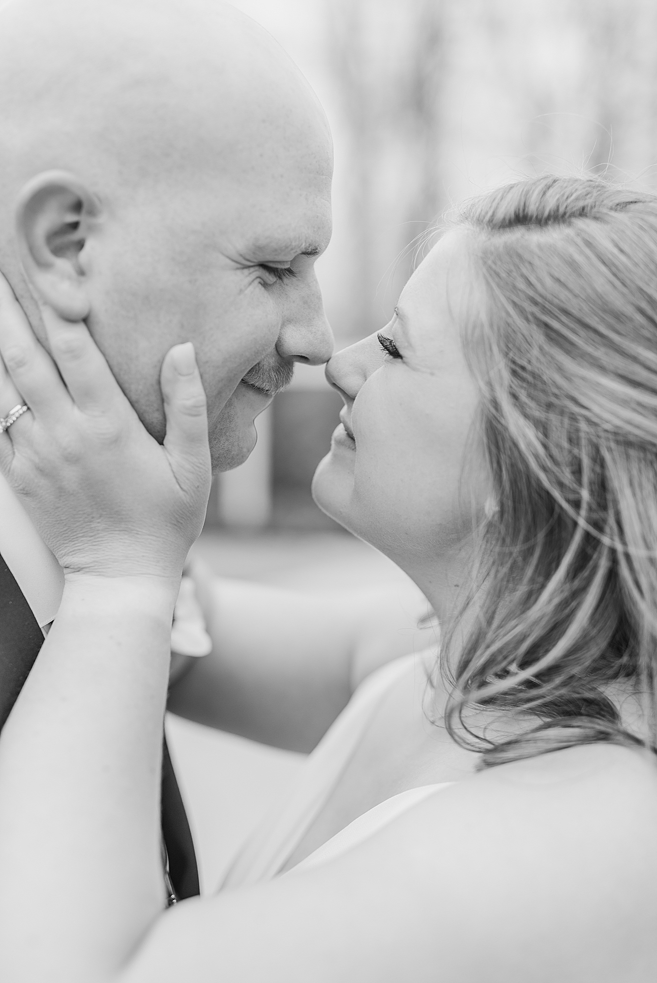 bride and groom nuzzle noses during Ohio wedding portraits