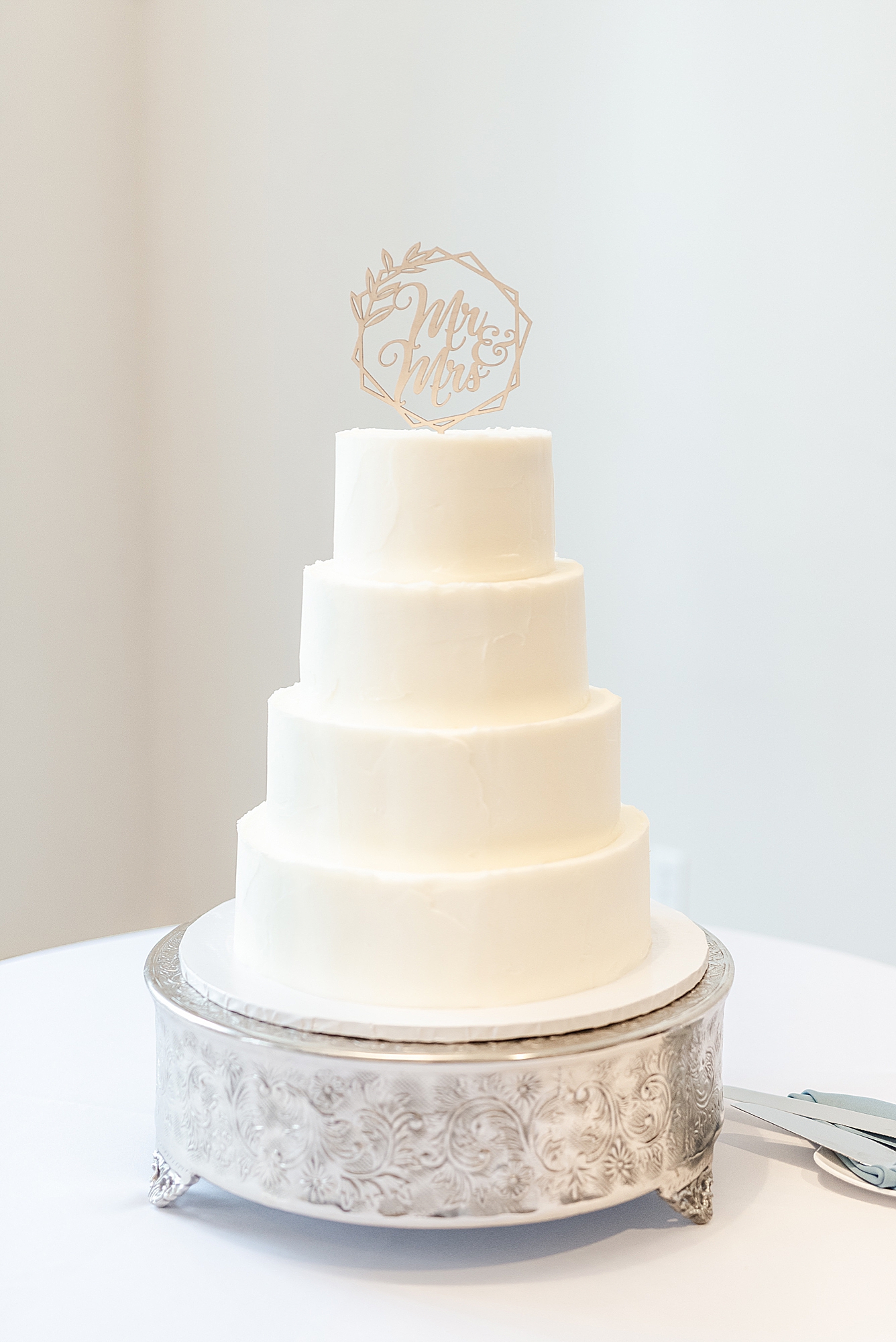 tiered wedding cake with simple cake topper at The Estate at New Albany