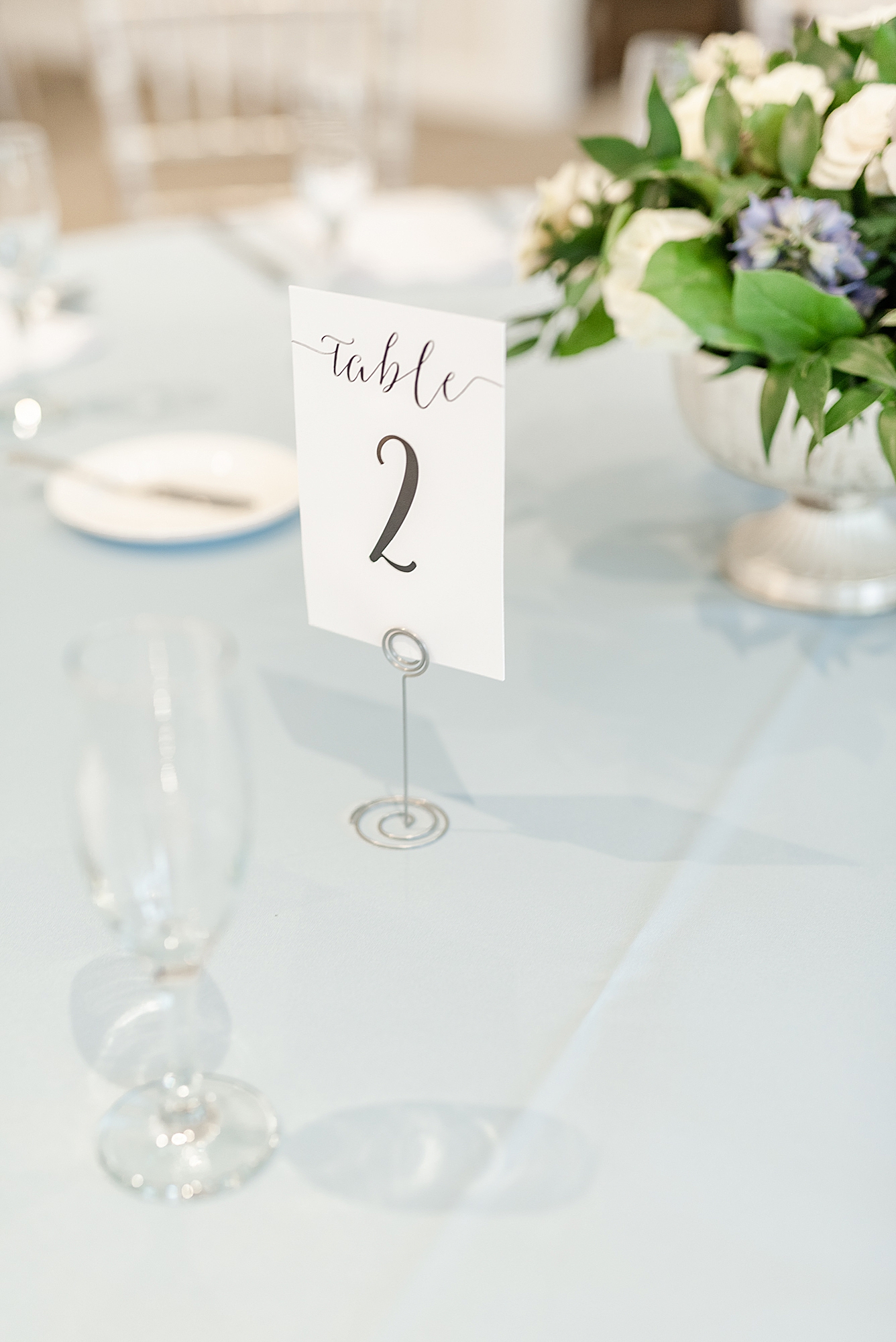 wedding table numbers on light blue table cloth