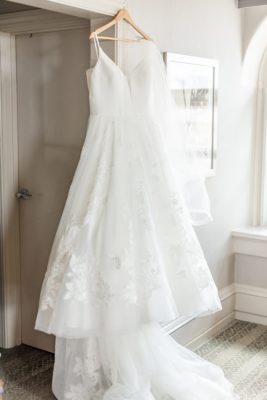 bride's dress hangs in bridal suite at High Line Car House