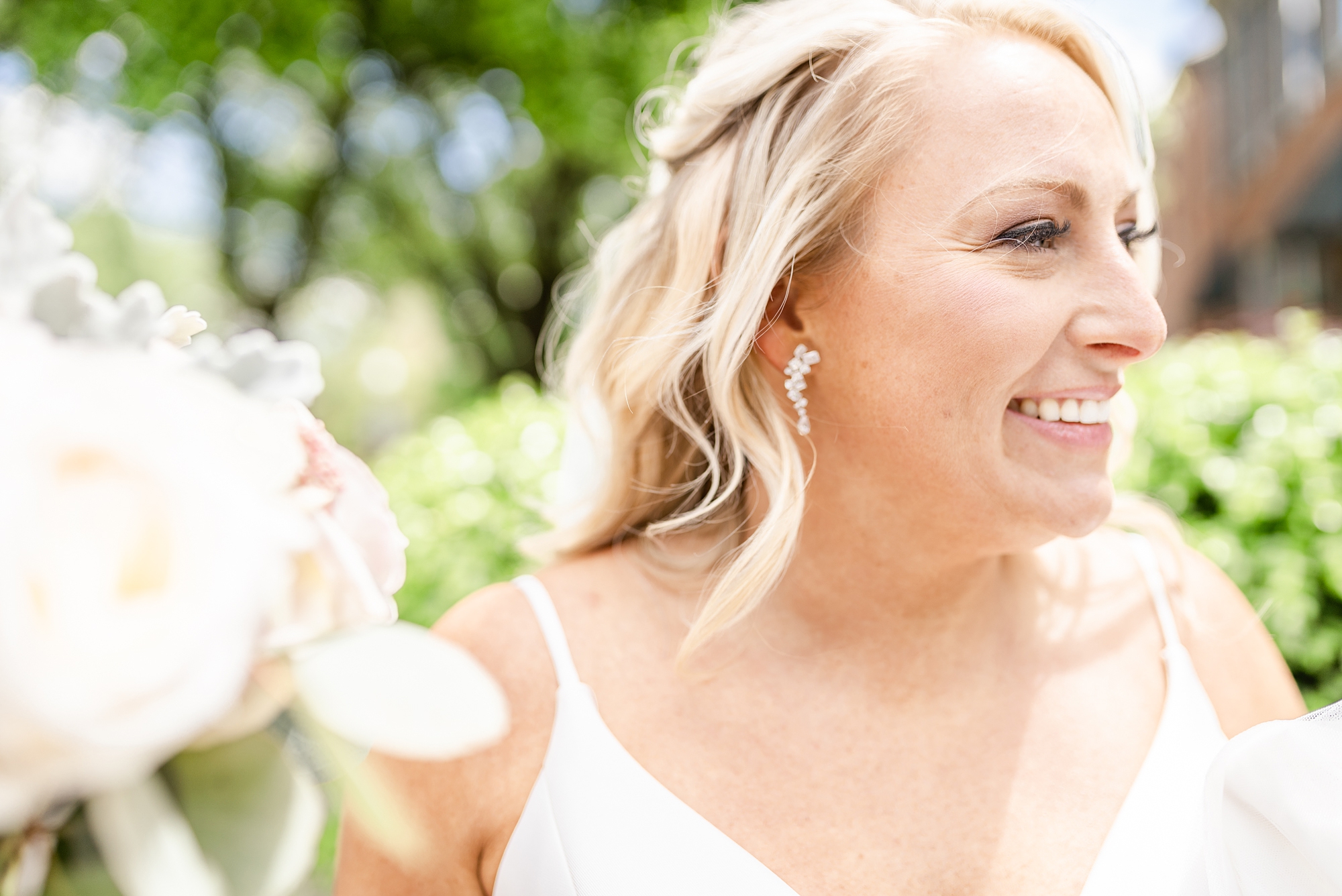 bride laughs looking over shoulder during Ohio wedding photos