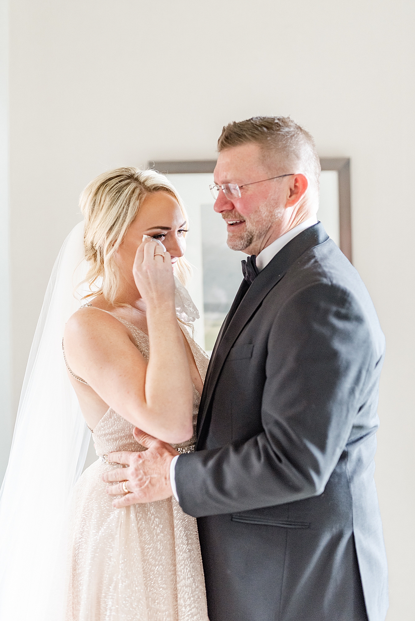bride and dad cry during first look