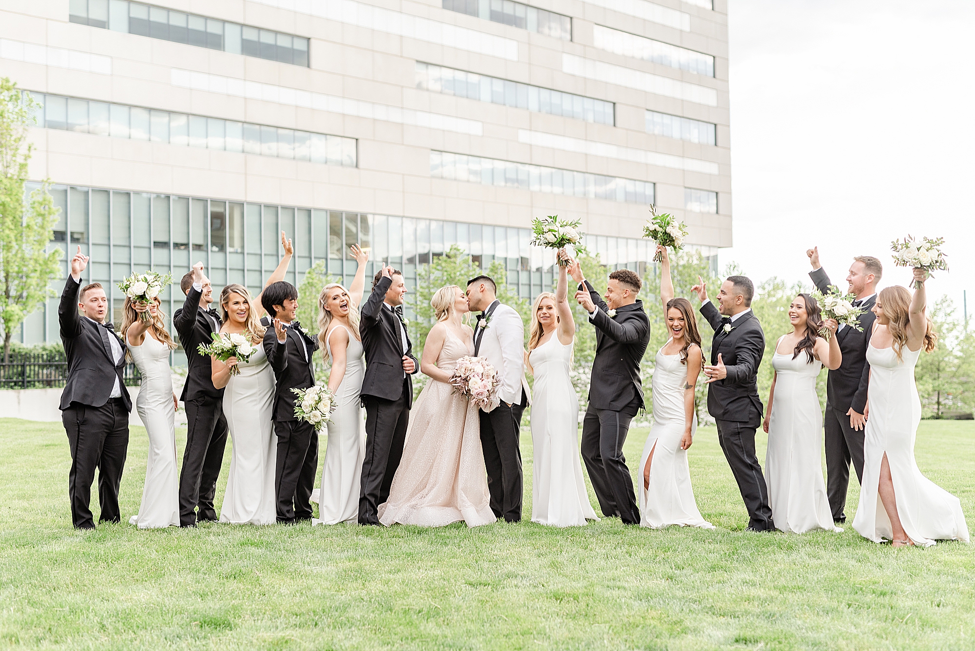 bridal party cheers during wedding photos at Westin Southern Columbus