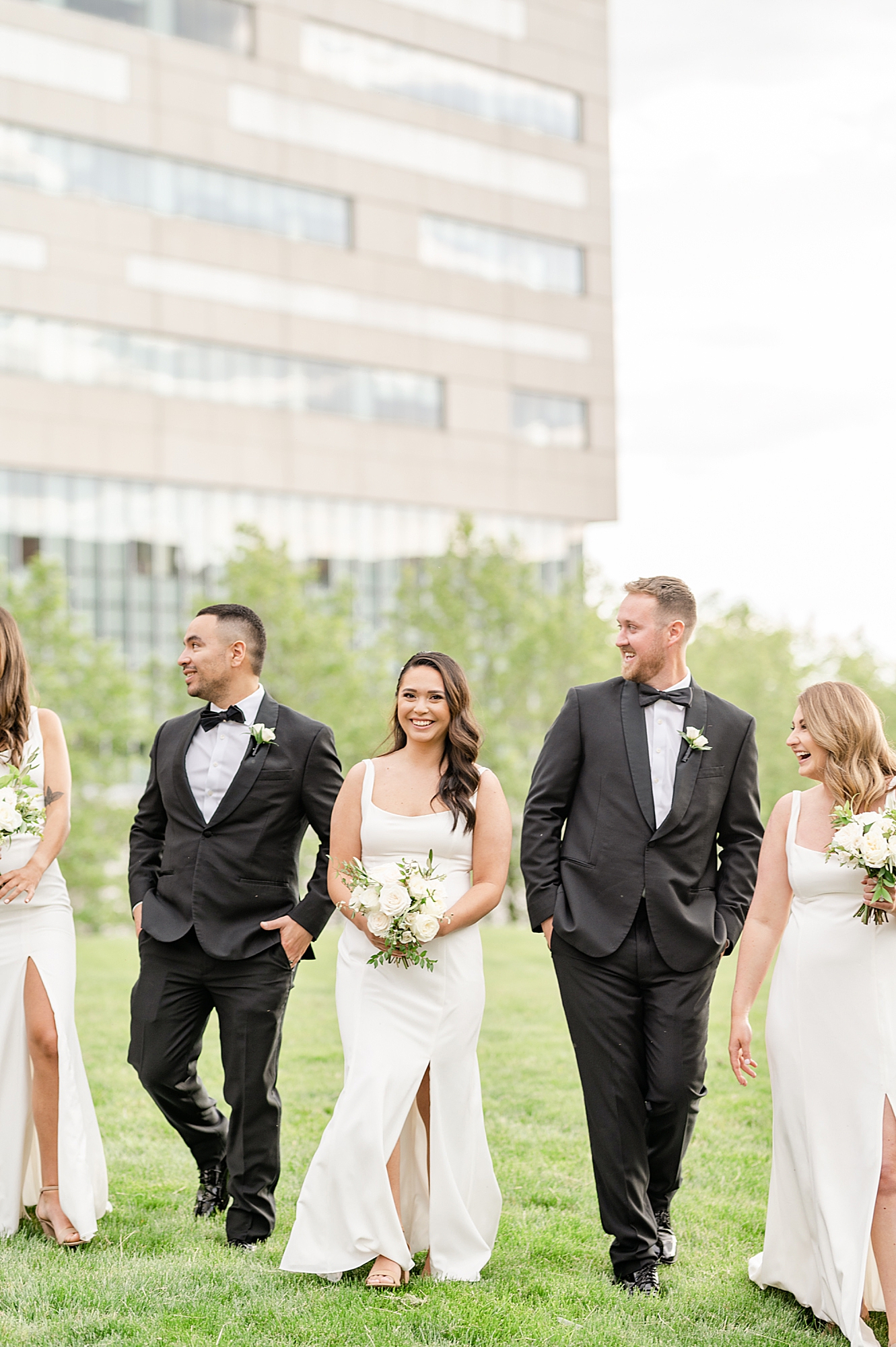bridal party walks with bride and groom