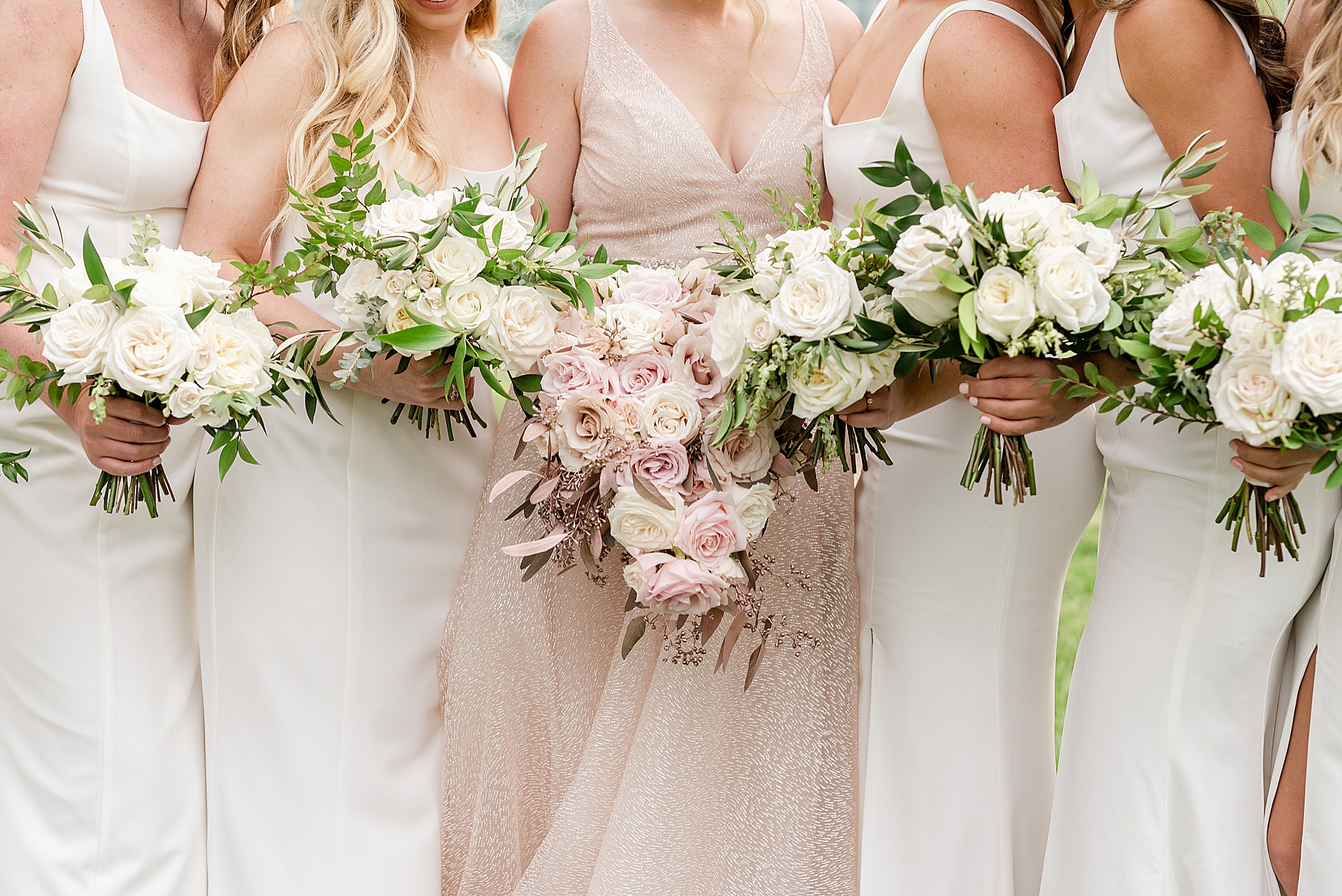 all-white bouquets for bridesmaids and bride