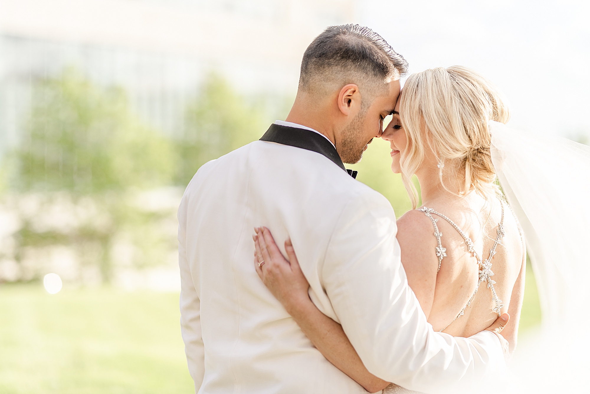bride and groom pose on lawn of Westin Southern Columbus