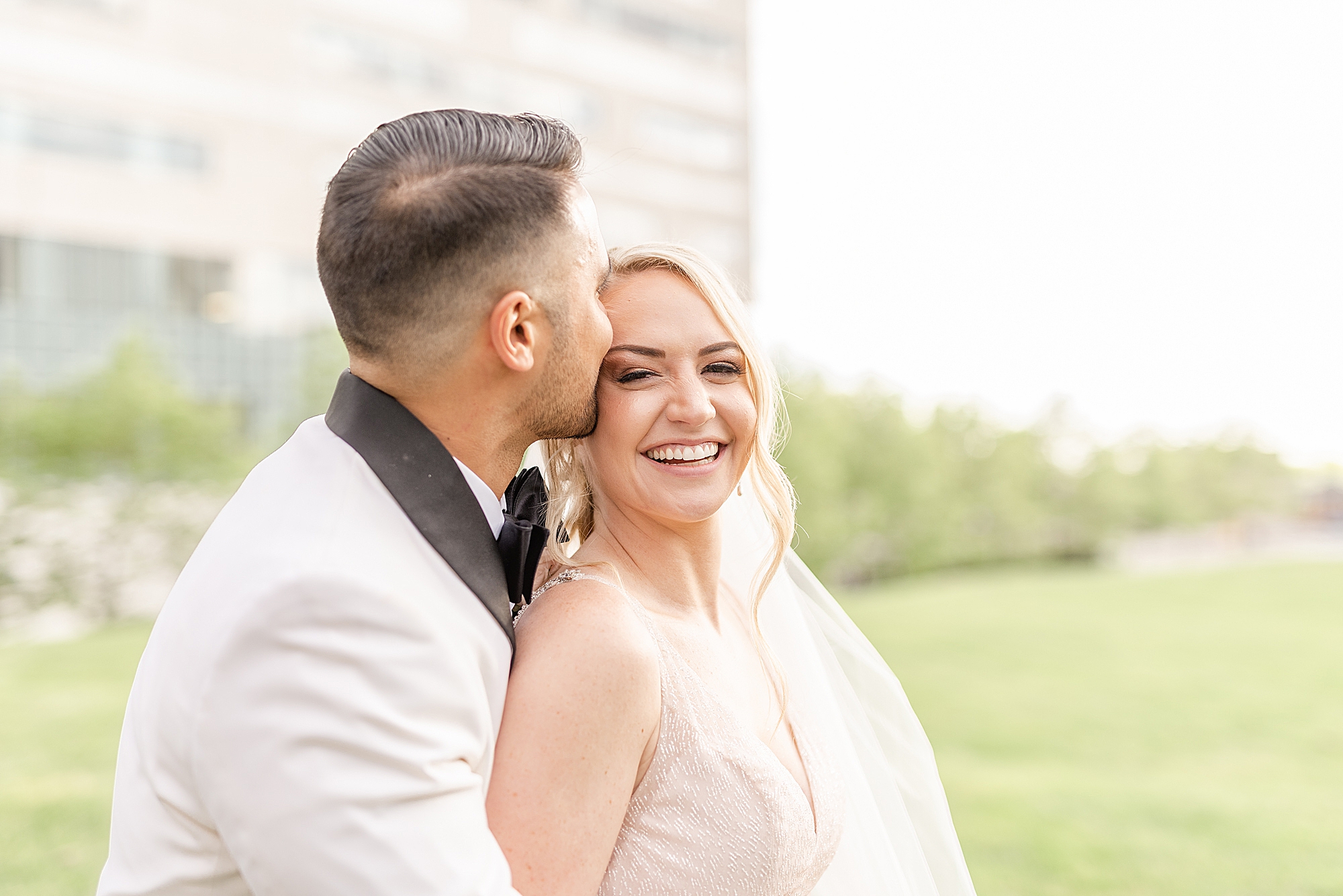 groom kisses bride's forehead during wedding photos at Westin Southern Columbus
