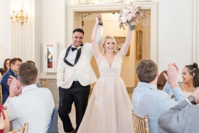 bride and groom cheer during Columbus OH wedding reception