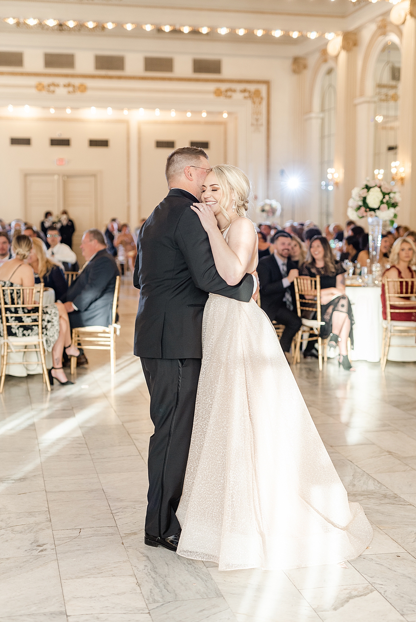 bride and dad hug on dance floor during Columbus OH wedding reception
