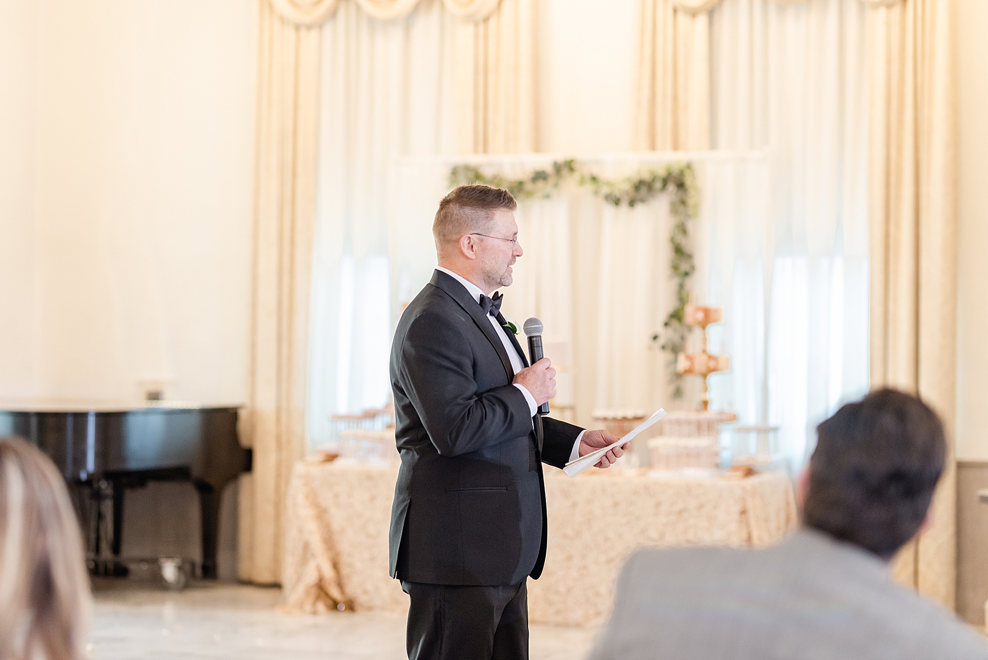 best man reads speech during Columbus OH wedding reception