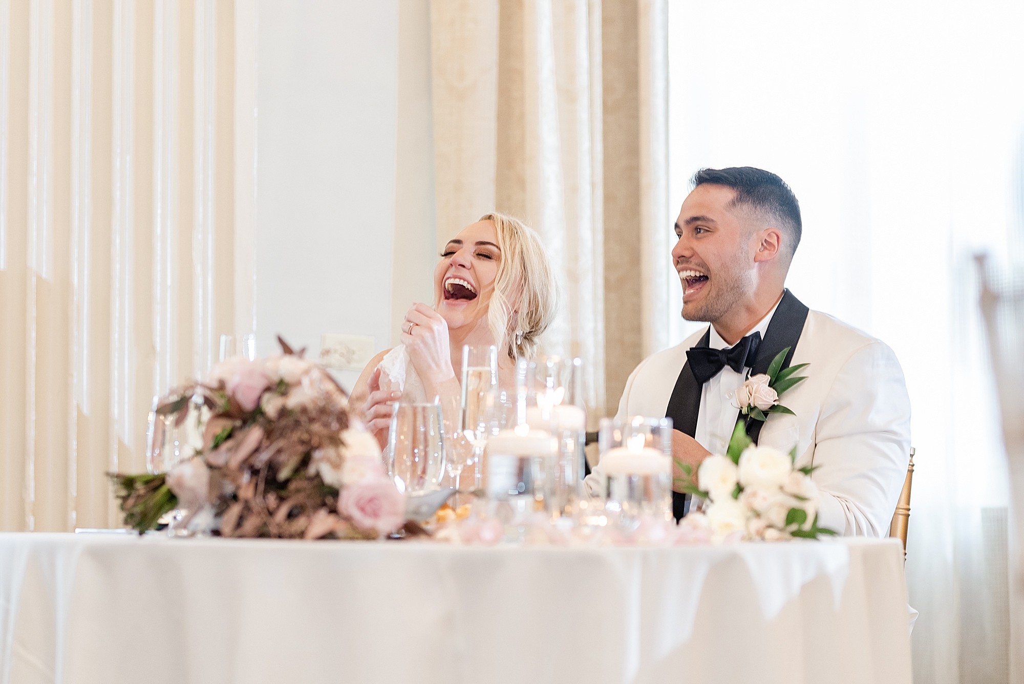 couple laughs during Columbus OH wedding reception