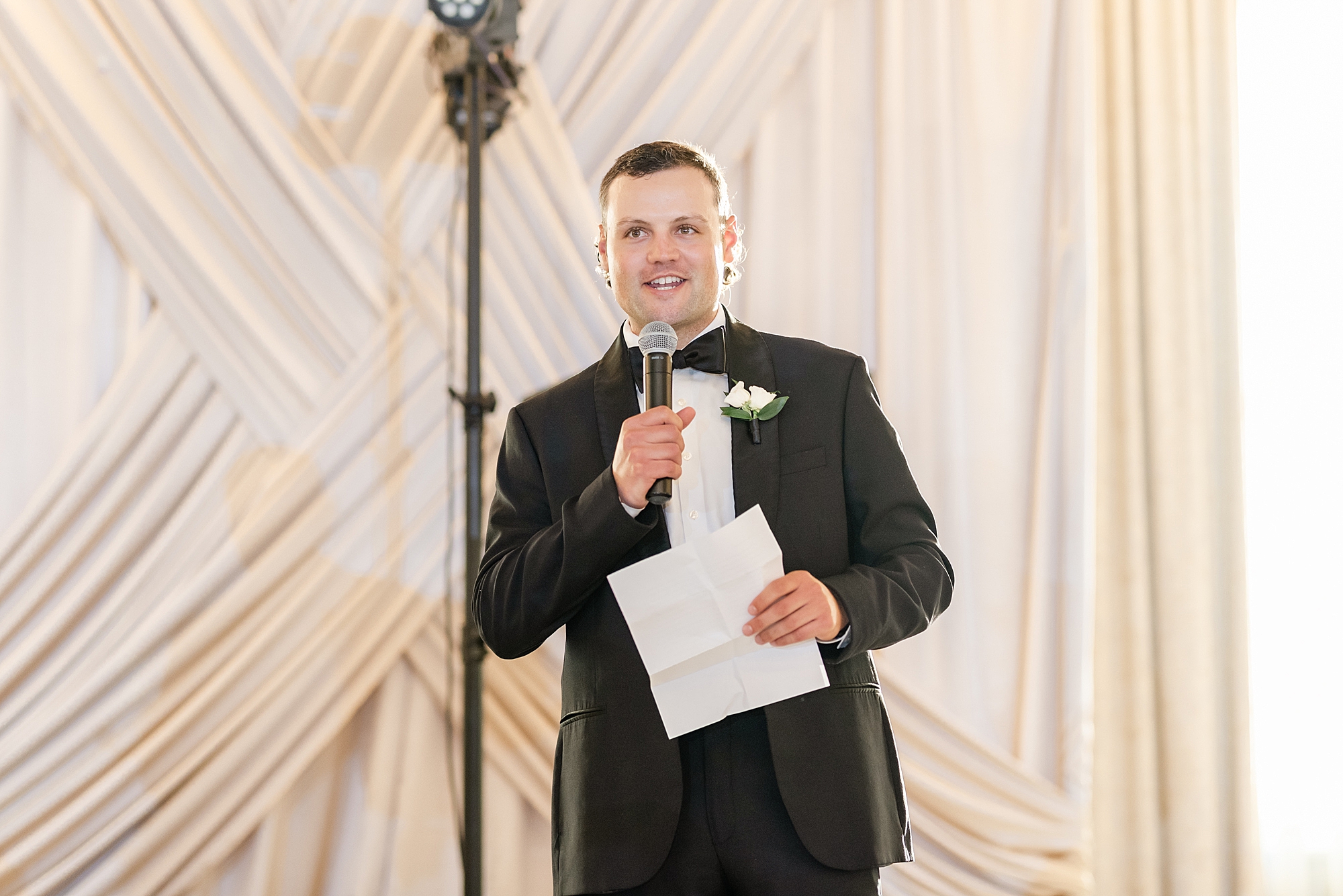 groomsman reads toast during Columbus OH wedding reception
