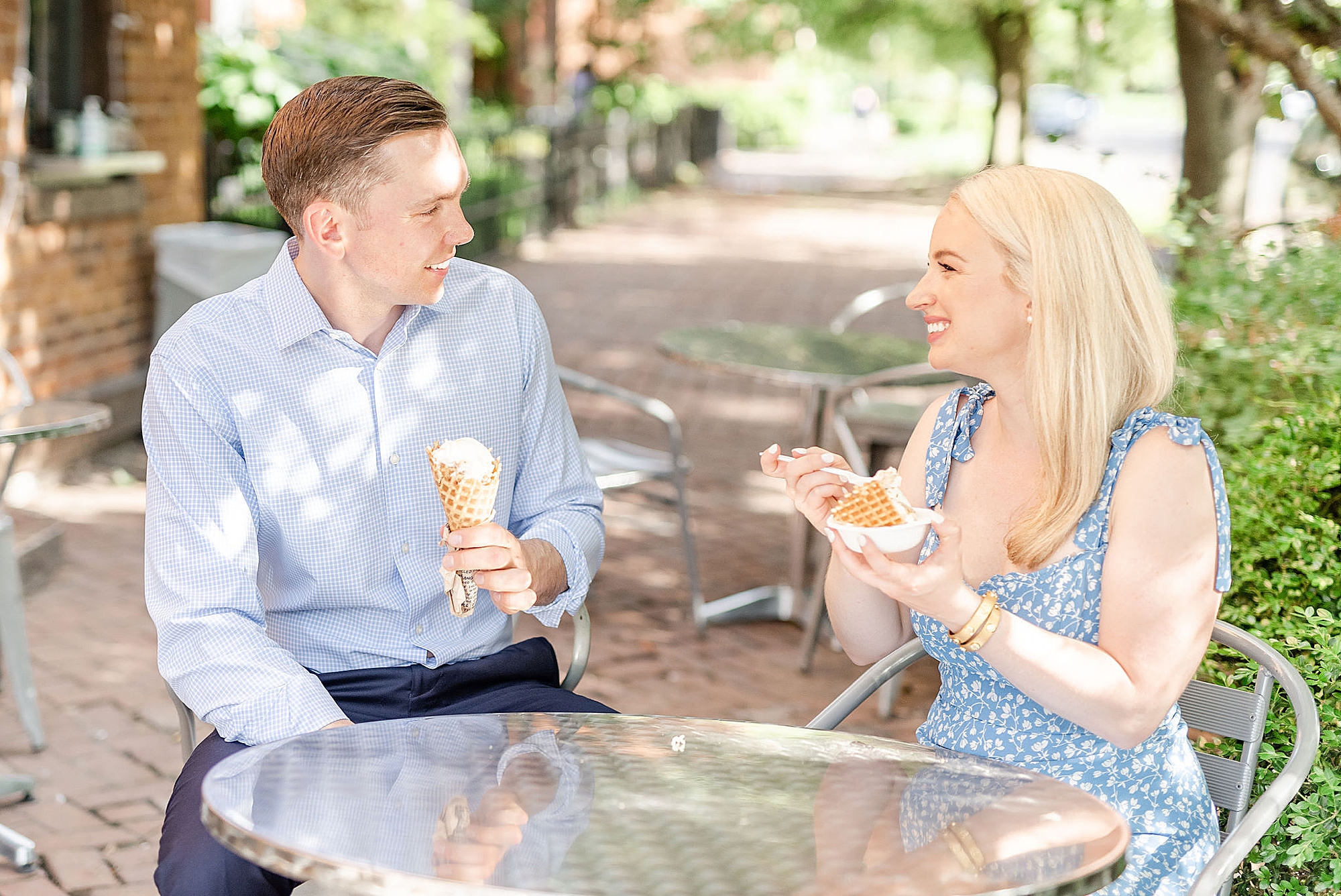 engaged couple eats ice cream during downtown Columbus engagement session