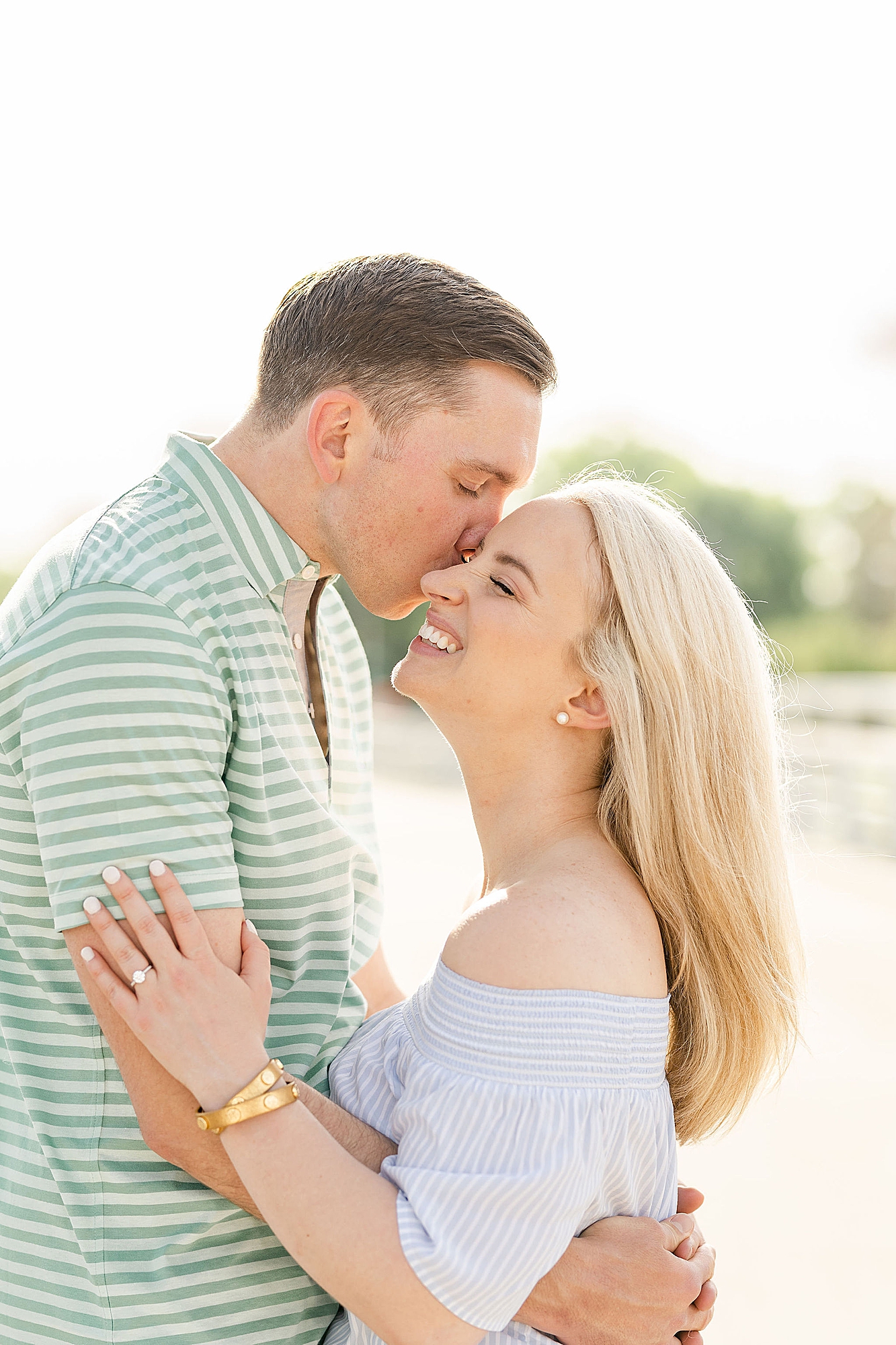 groom nuzzles bride's cheek during Ohio engagement session