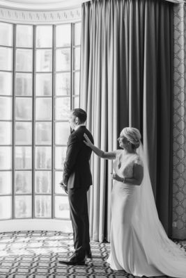 bride taps groom's shoulder for first look at the Athletic Club of Columbus