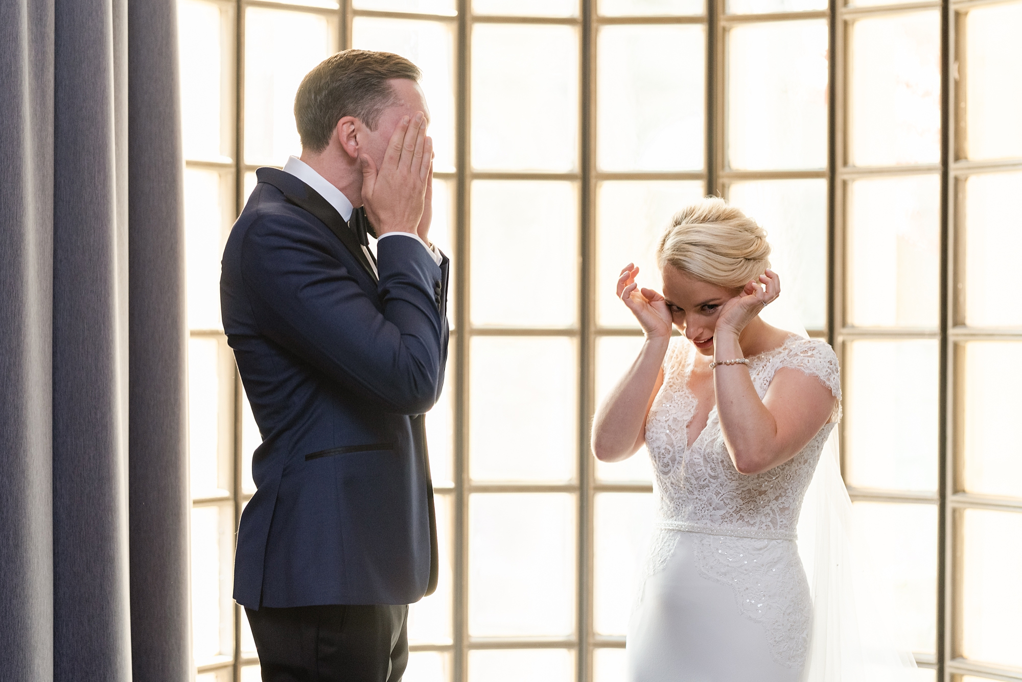 bride and groom cry during first look at the Athletic Club of Columbus