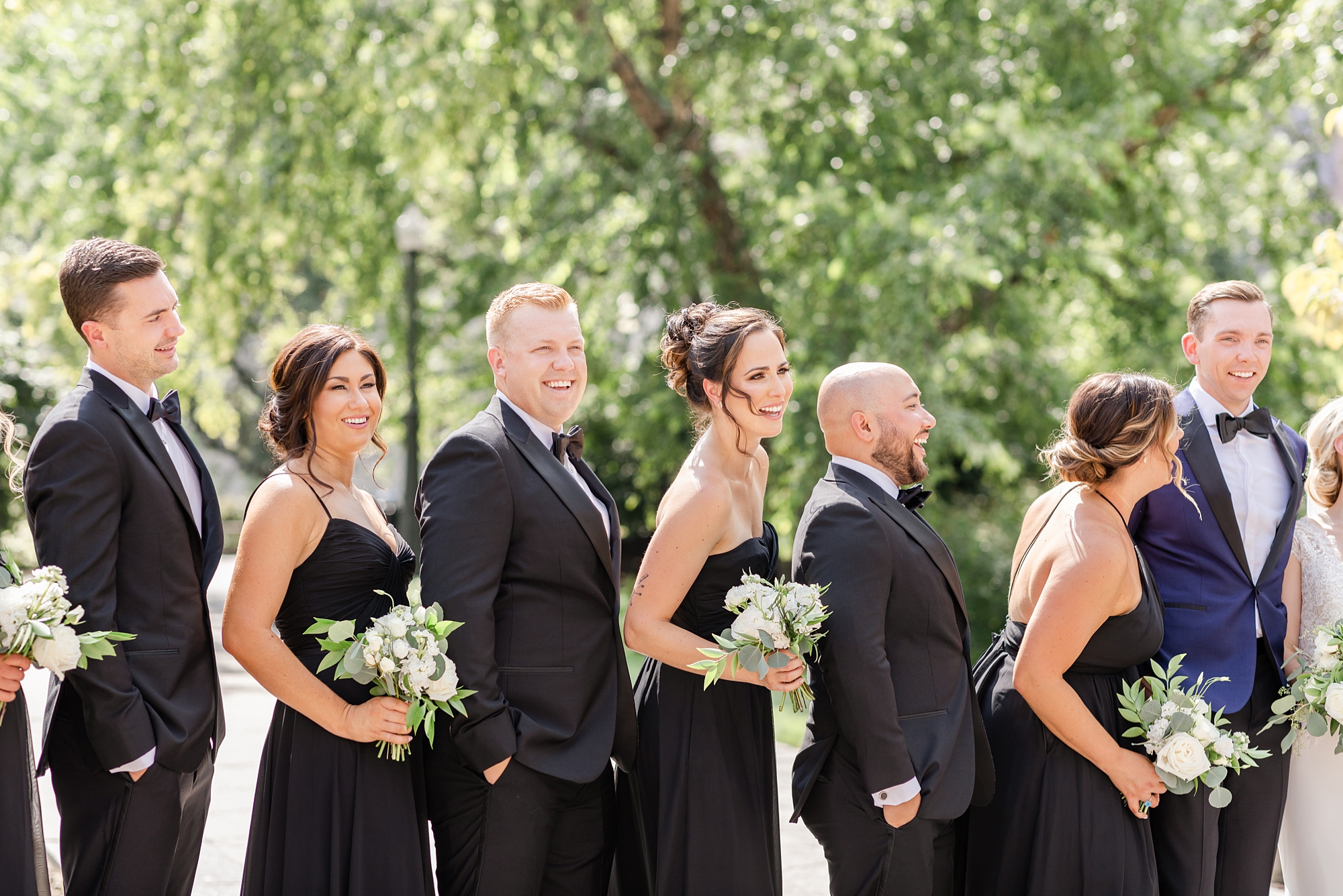 wedding party laughs during photos in Columbus OH