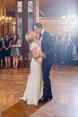 newlyweds kiss on dance floor during Columbus OH wedding reception