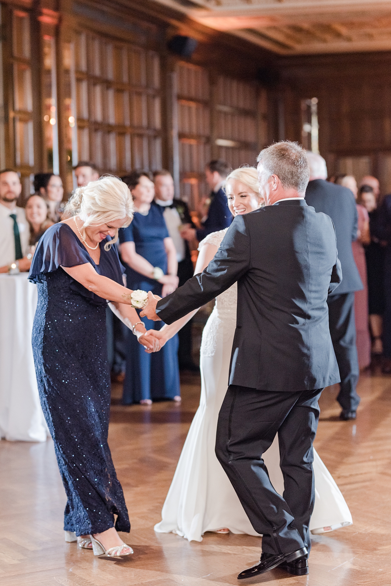 groom and mother in law dance together during Columbus OH wedding reception