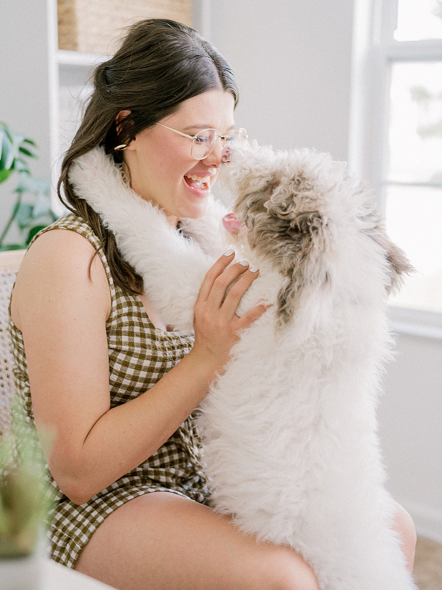 woman hugs dog during branding session