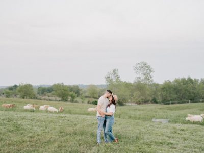 married couple hugs in field during Ohio anniversary photos